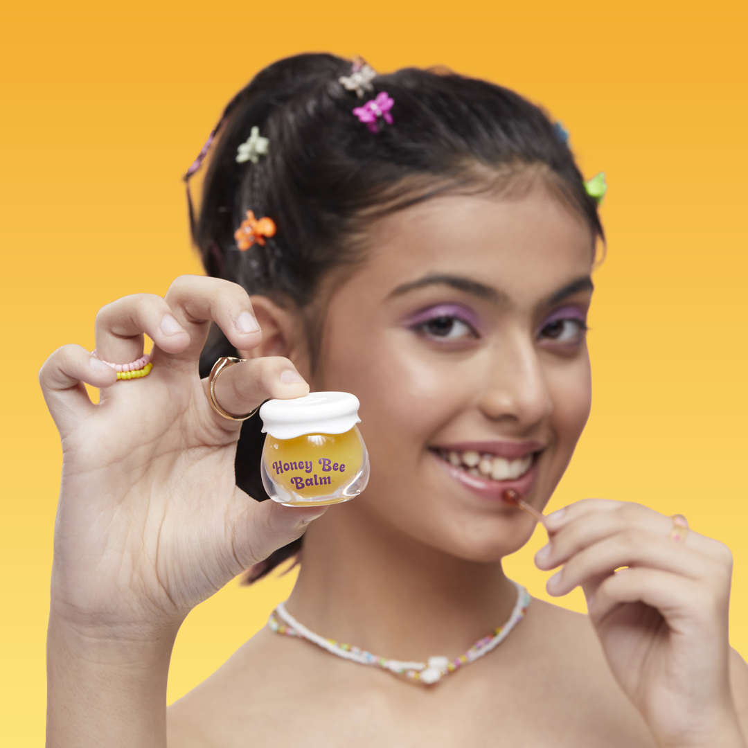teen applying Hey Teen Honey Bee Lip Balm – natural glossy non-sticky finish India